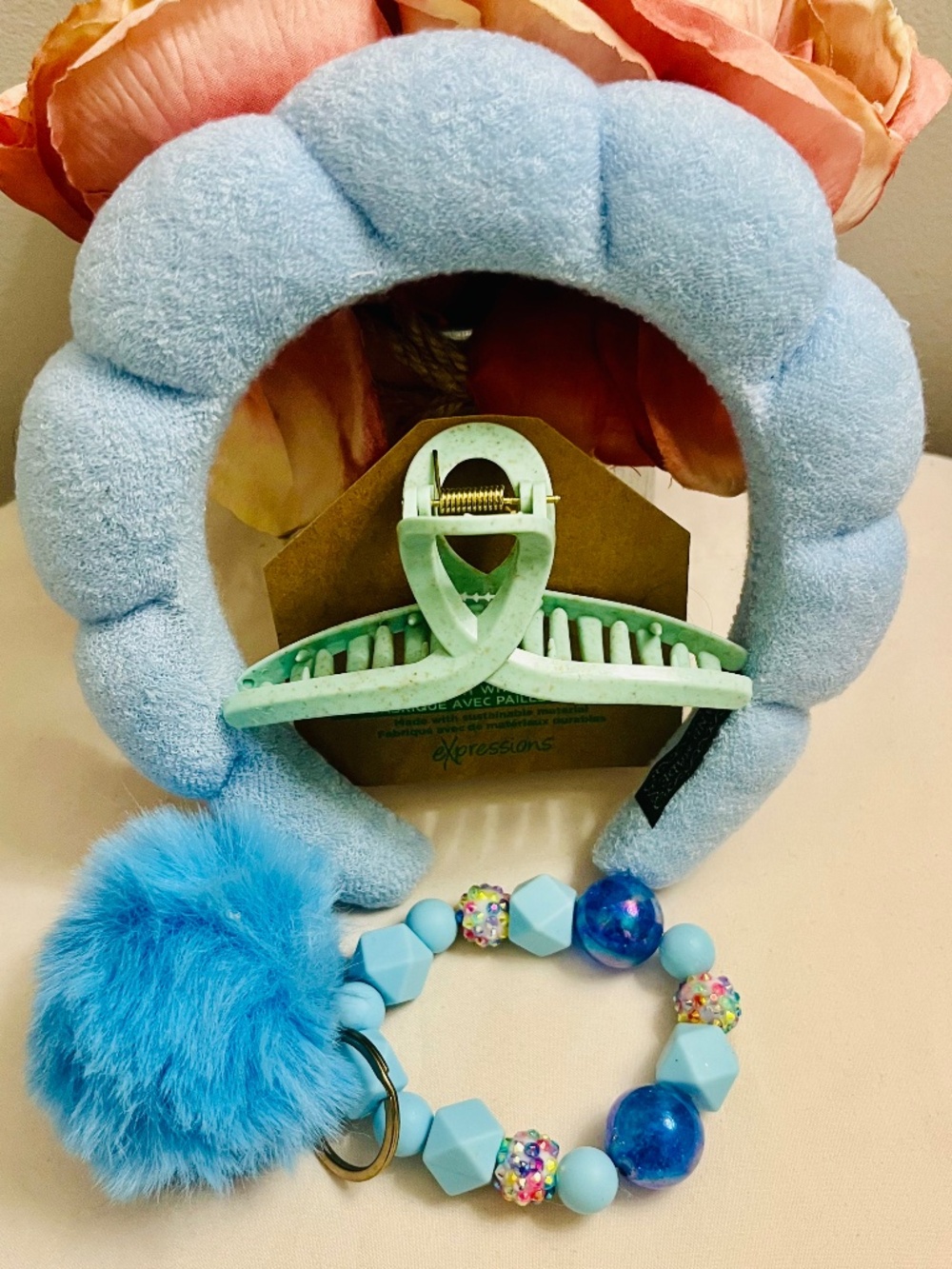 Expressions NWT Light blue hair bundle and bag charm.
